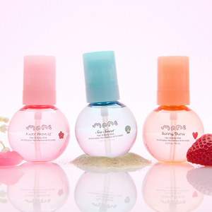 3 bottles of Pinky Promise, Sea Sweet, and Sunny Buns Hair & Body Mists in a line on a pink background