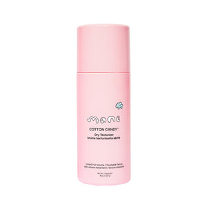 Pink bottle of 'Cotton Candy' dry texturizer by mane on a white background