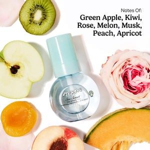 Sea Sweet Hair and Body Mist bottle amid sliced kiwi apple and pink rose in a bright fruit and flower layout