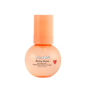 Orange bottle of Sunny Buns Mist on a white background