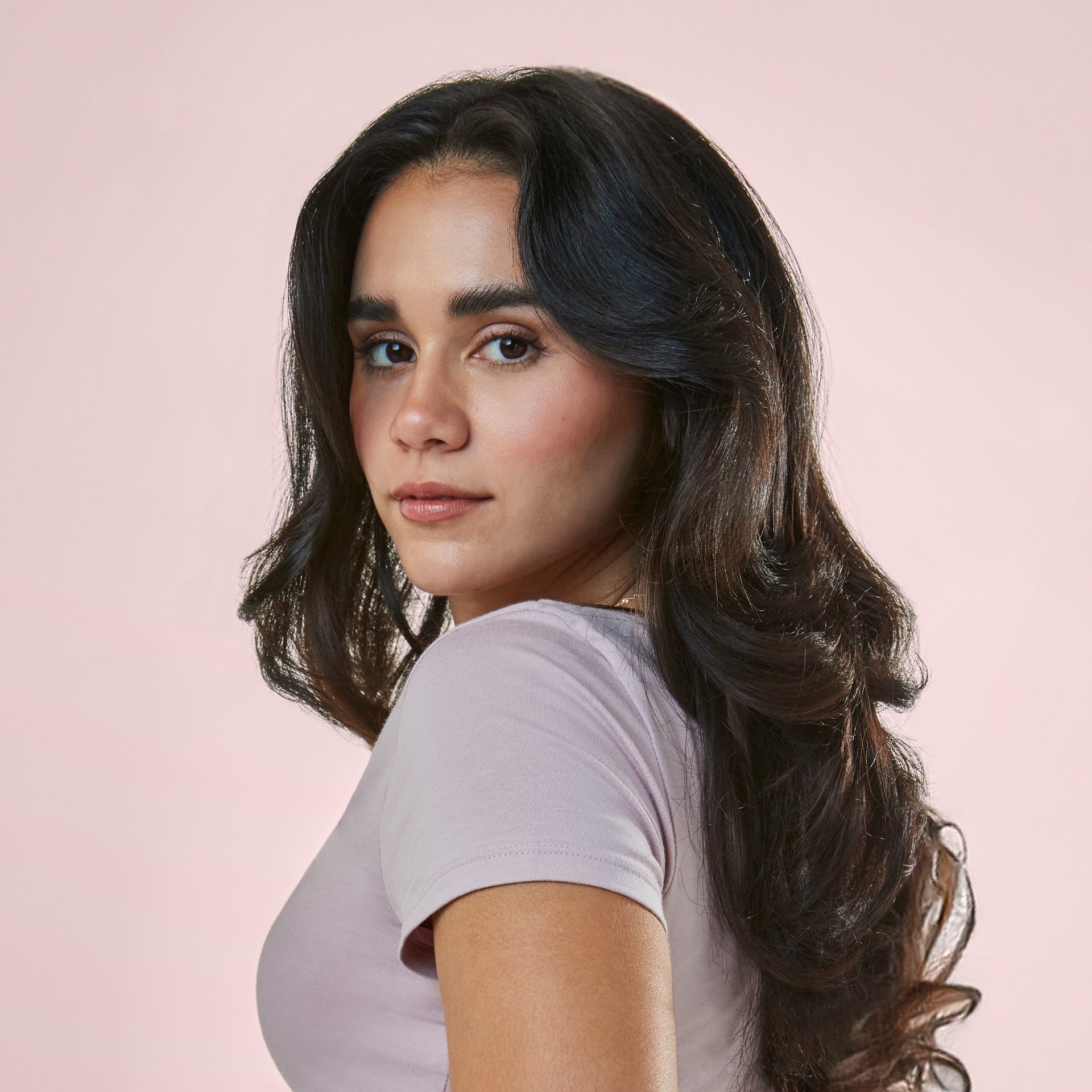 after picture of model using mane by jen atkin brb 1.3 inch ceramic round hair brush