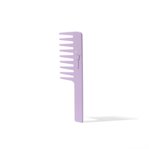 Knot Ur Avg wide-tooth detangling comb in lavender beside a pale curling wand