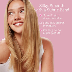 A smiling woman with long, straight blonde hair looks upward against a pink background, with promotional text on the right describing silky smooth styling results.