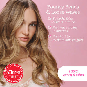 A woman with long, wavy blonde hair shown against a pink background, with promotional text reading 'Bouncy Bends & Loose Waves' and a red Allure badge. The product itself is not directly visible, so this is best classified as Lifestyle rather than Product/Packaging.