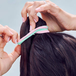 model tying hair with Rainbow Fabric Hair Ties