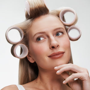 Woman with Roll & Scroll Self-Grip Rollers in hair