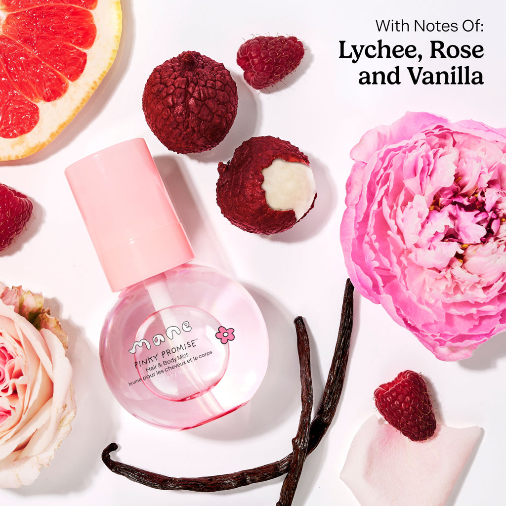Pink hair and body mist bottle with lychee, rose, and vanilla elements on a white background