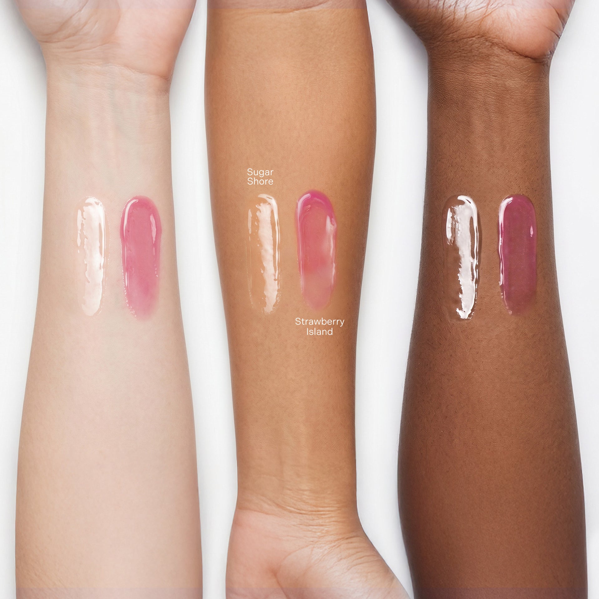 Swatches of lip gloss on 3 different skin tones