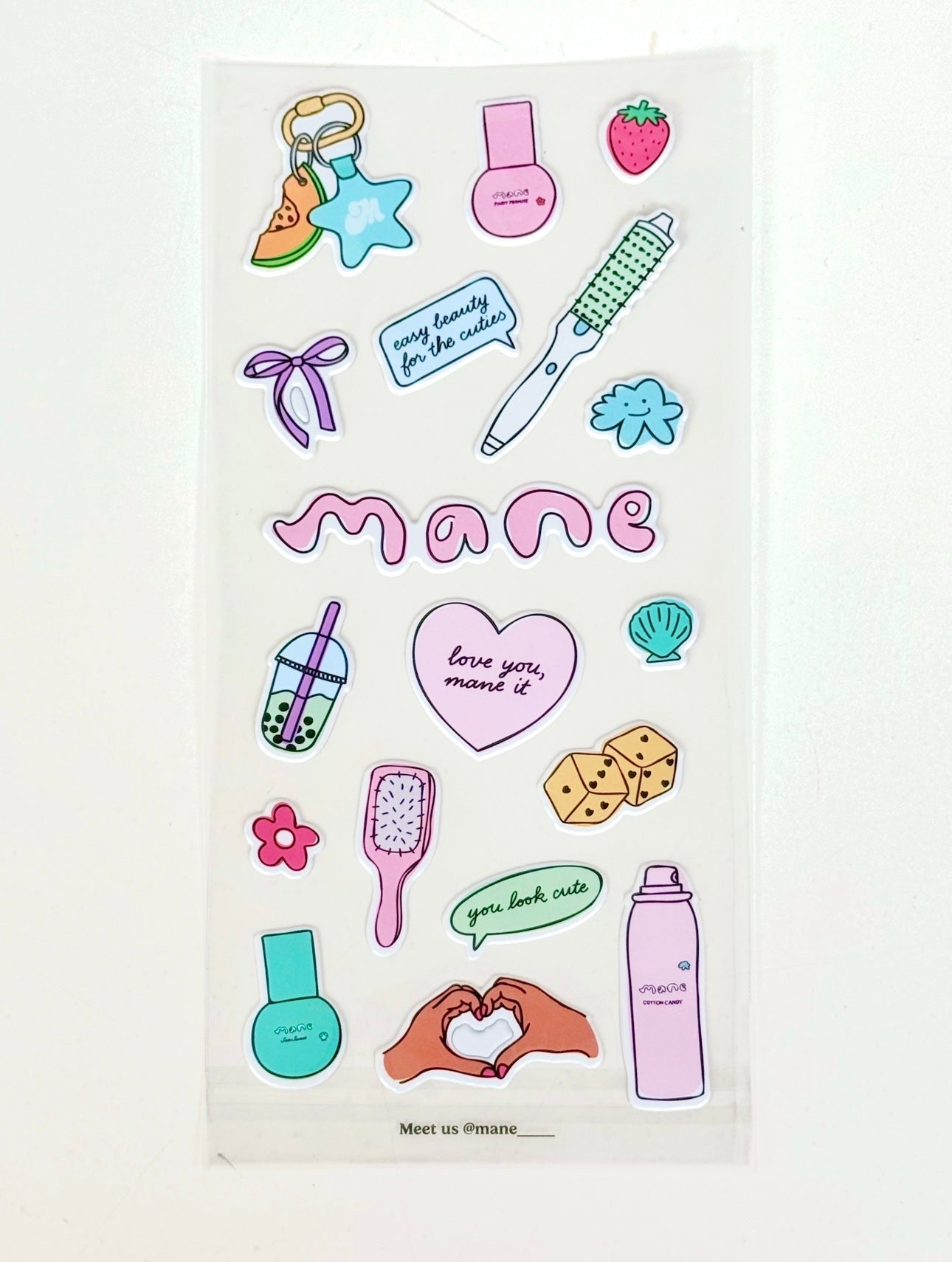 Sheet of colorful stickers with various designs on a white background