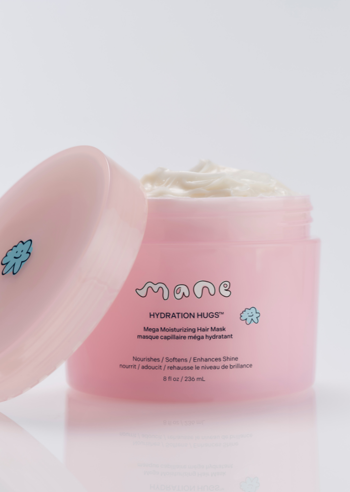 Pink hair mask jar with 'mane' brand on a light gray background