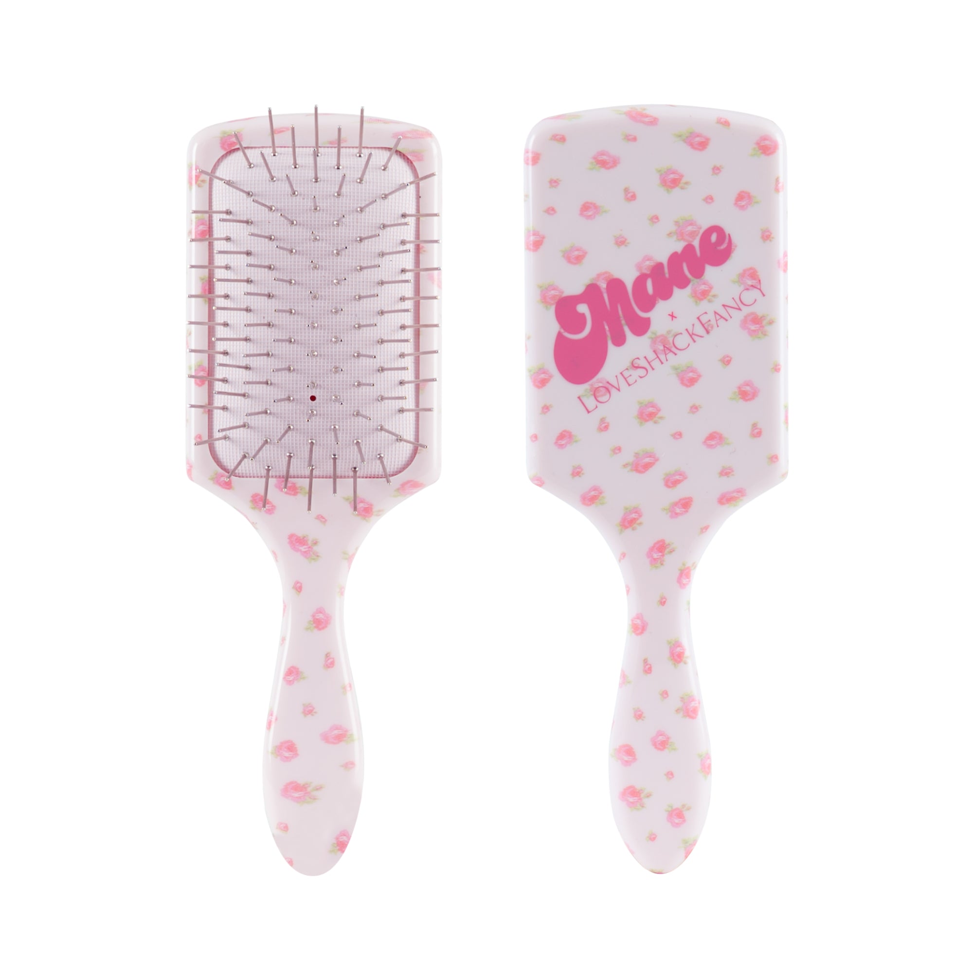 Two views of a paddle hairbrush with a white body decorated with pink strawberry patterns. One view shows the bristle underside with metal pins, and the other shows the back with the brand name 'Mare' and 'LEVENSHACKS' in pink script.