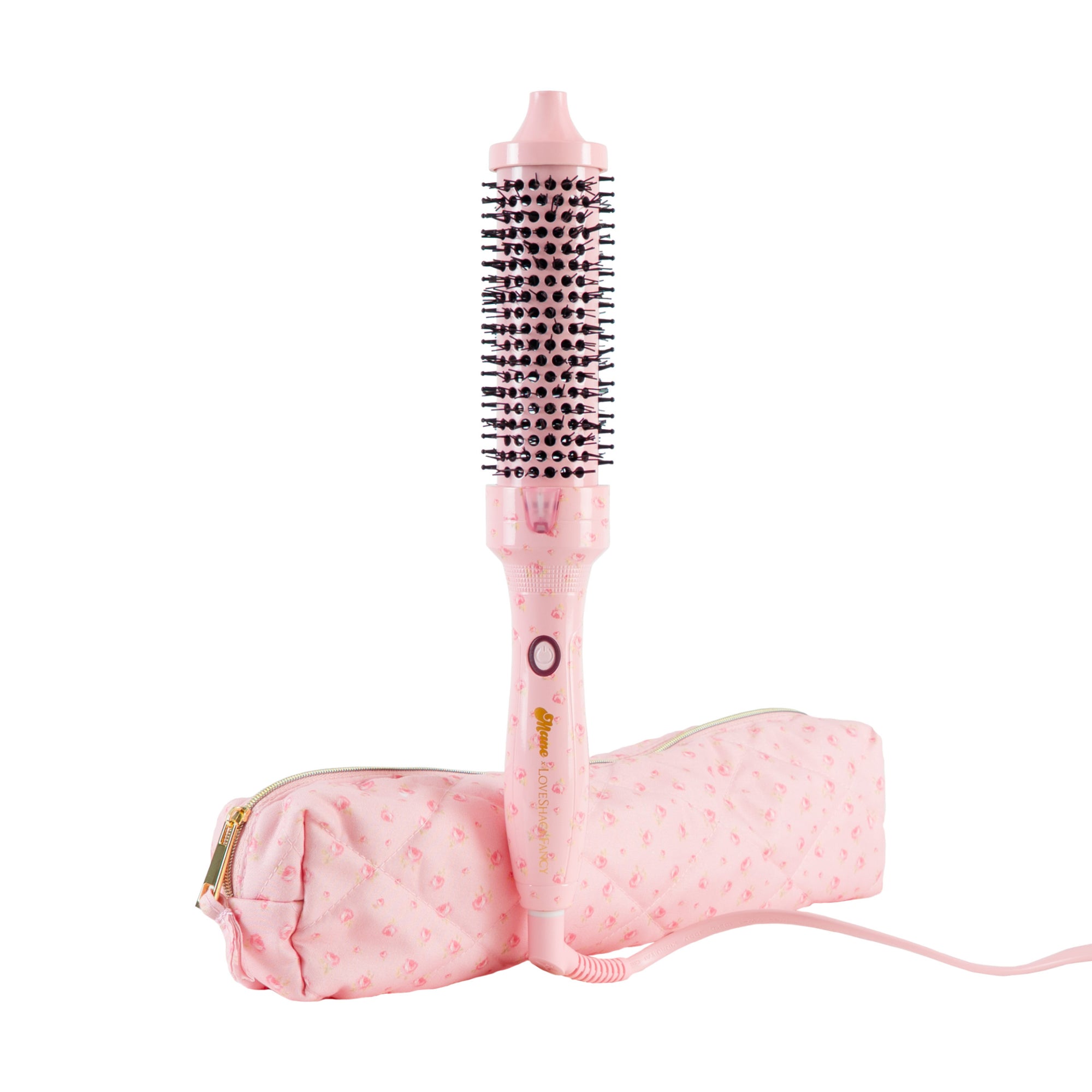 A pink hot air brush hair straightener with a matching pink patterned carrying pouch, shown on a plain white background.