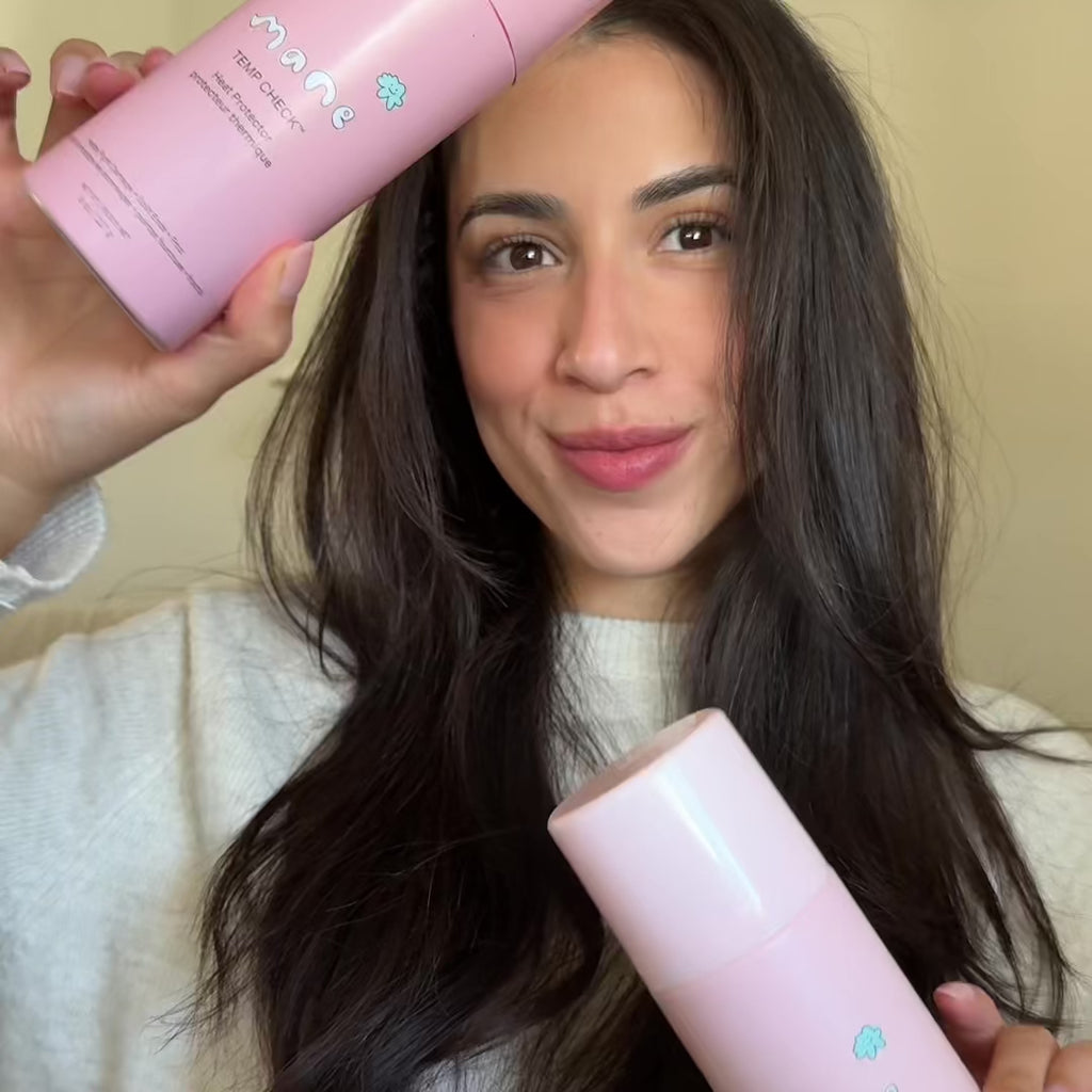 Video of woman using Temp Check heat protectant and hot round brush to style hair