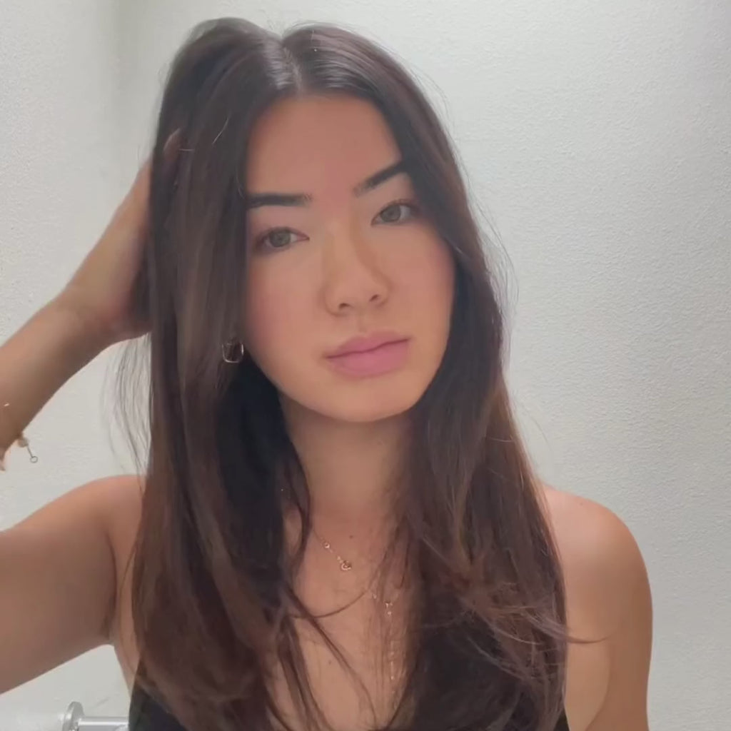 Video of woman styling hair with jumbo hot round brush.  