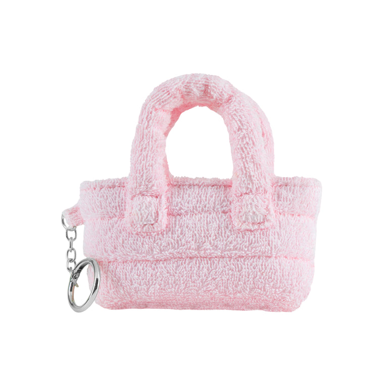 Pink plush handbag keychain on a white background
